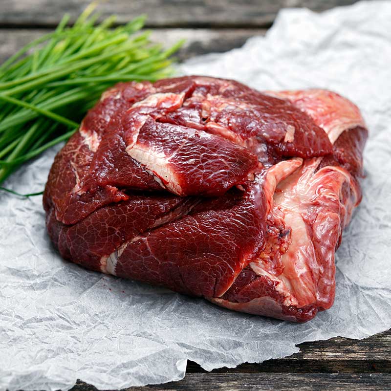 raw beef cheek meat on butcher paper