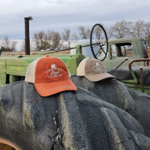 Christensen Ranch Washed Trucker Caps in Orange and Khaki and Driftwood and Khaki with embroidered logo