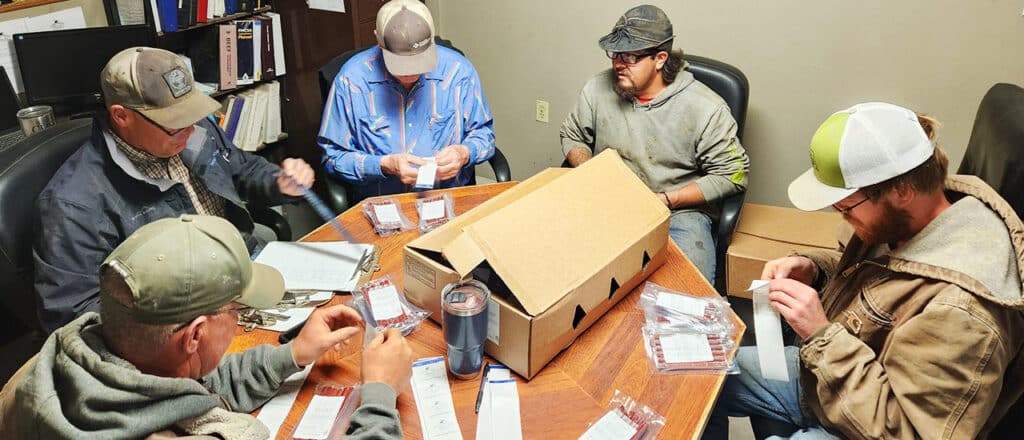 ChristensenRanch crew putting labels on Beef Stick packages being donated to Take A Kid Fishing Days fishing derby