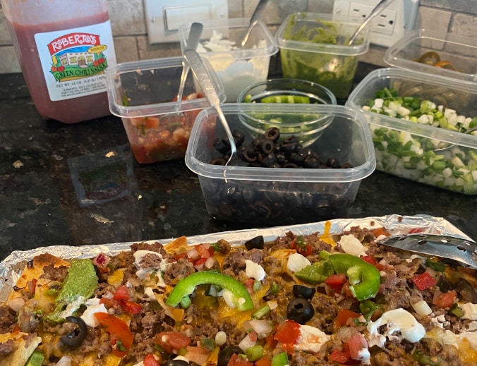Jodi's recipe for Sheet Pan Nachos includes Christensen Ranch Single Source Ground Beef and Christensen Ranch Taco Seasoning for a quick and easy dinner