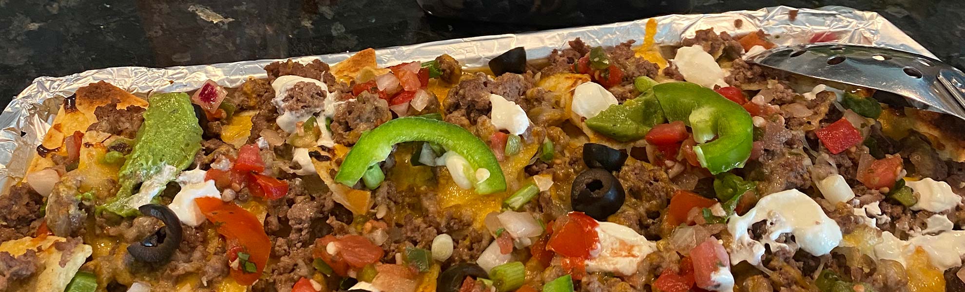 Jodi's Sheet Pan Nachos are made with Christensen Ranch Ground Beef and Christensen Ranch Taco Seasoning