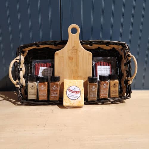 Mother's Day Charcuterie gift box from Christensen Ranch featuring pepper jack and original beef sticks, sunset cheddar cheese, engraved charcuterie board, and six Christensen Ranch seasonings