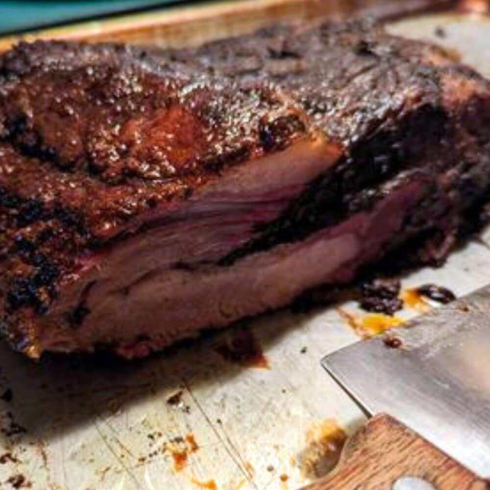 Christensen ranch beef brisket whole sliced to show tender, juicy cut of beef